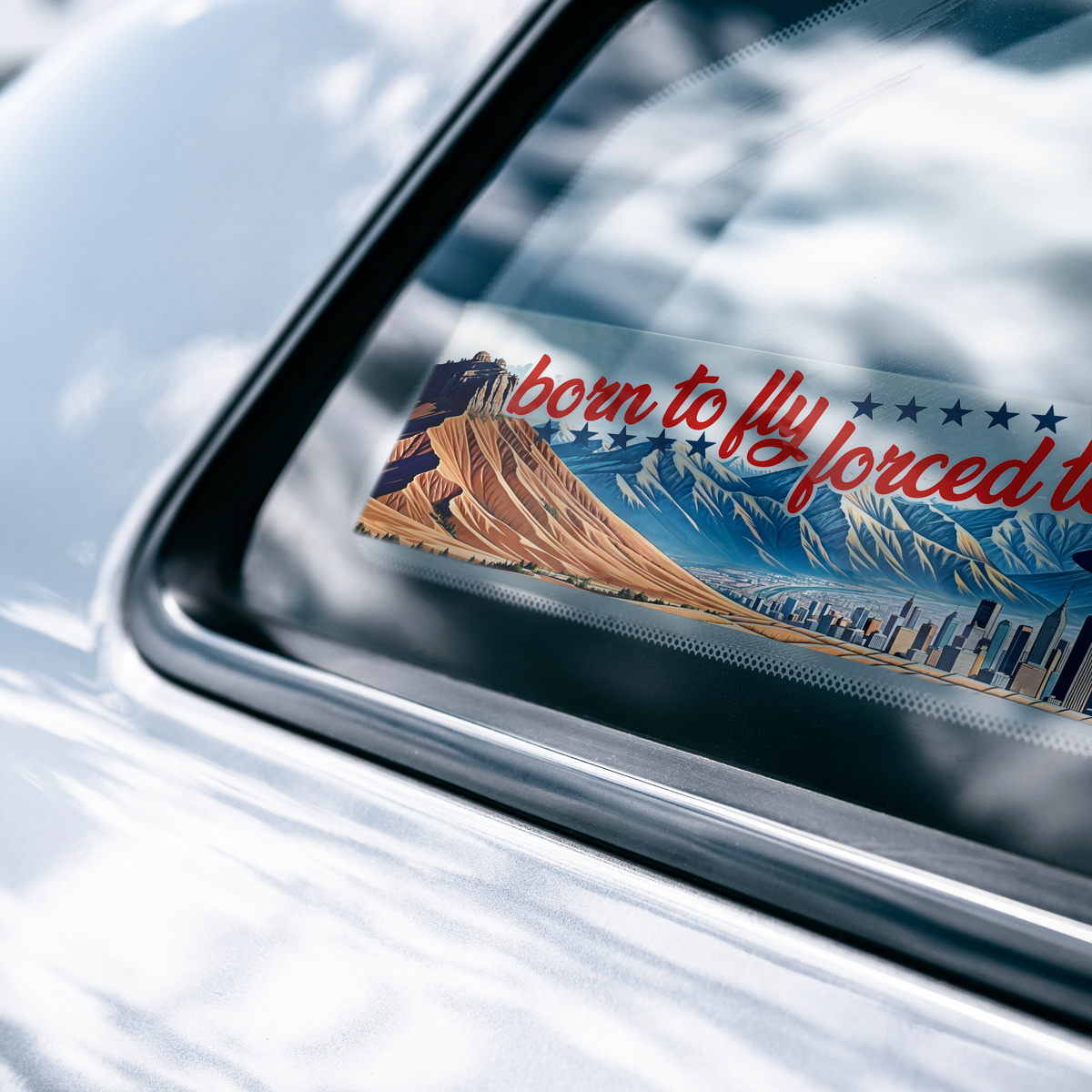 Born_to_fly_forced_to_drive_bumper_stick_ClearBumperSticker_CarWindow_Mockup.png_15837403