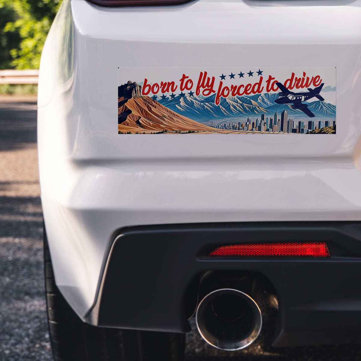 Born_to_fly_forced_to_drive_bumper_stick_ClearBumperSticker_Closeup_bumper_Mockup.png_15837400