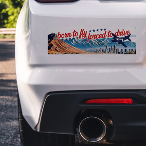 Born_to_fly_forced_to_drive_bumper_stick_ClearBumperSticker_Closeup_bumper_Mockup.png_15837400